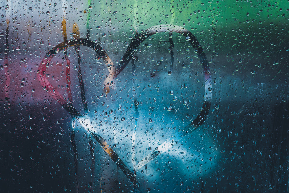 heart shape traced on condensation covered window