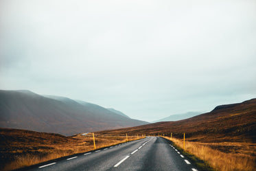 highway through brown hills fields