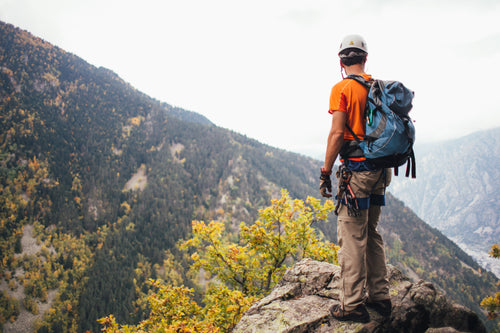 Hiker Climbing Mountains