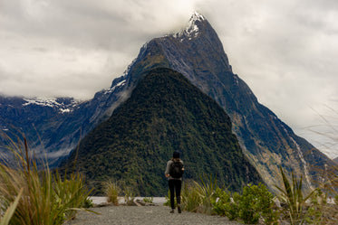 hiker observing mountain peak