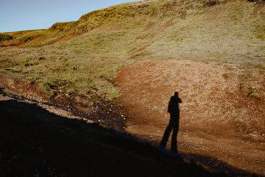 hiker shadow on hill