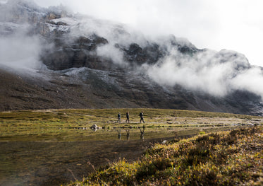 hikers below the misty mountains