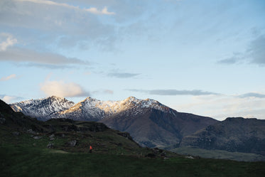 hikers near snow capped mountains