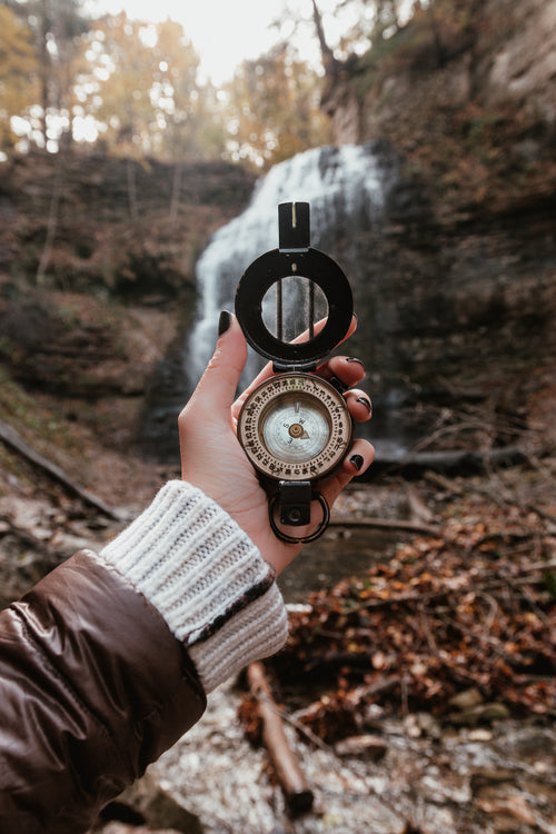 hiking with a compass near waterfalls