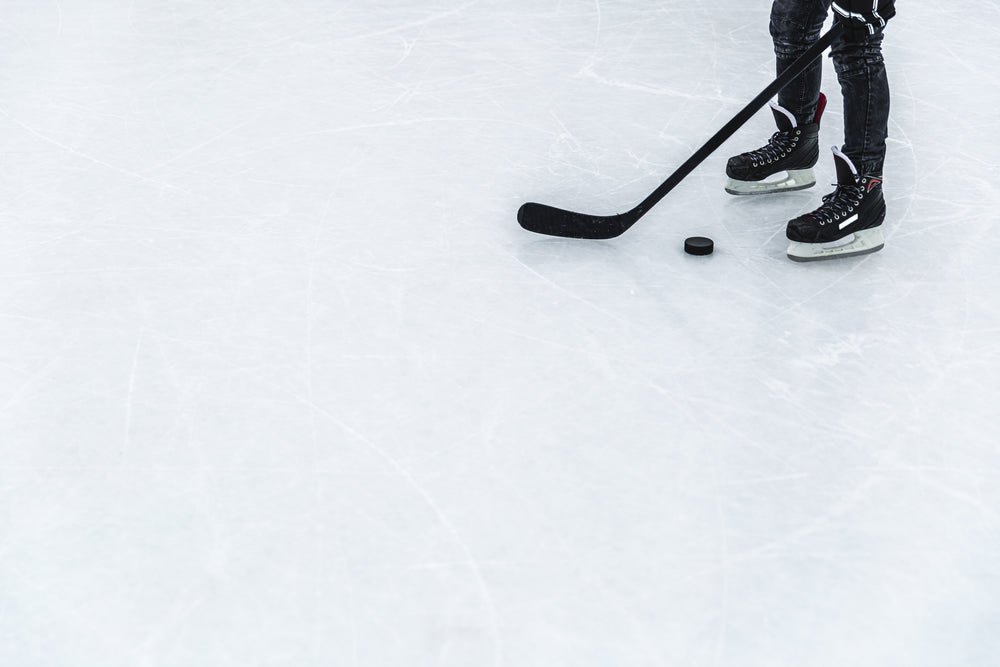 hockey player catching their breath on the ice