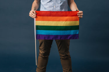 holding a small pride flag