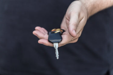 holding car keys