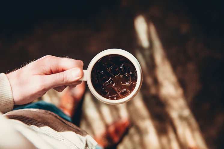 Holding Cup Of Iced Coffee