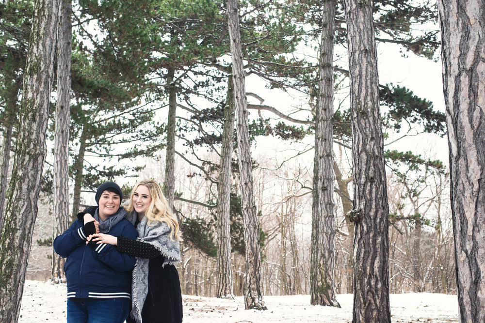 holding each other closely during a winter walk