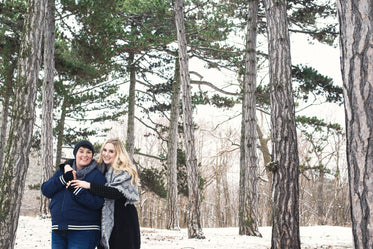 holding each other closely during a winter walk