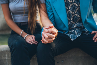 holding hands as couple