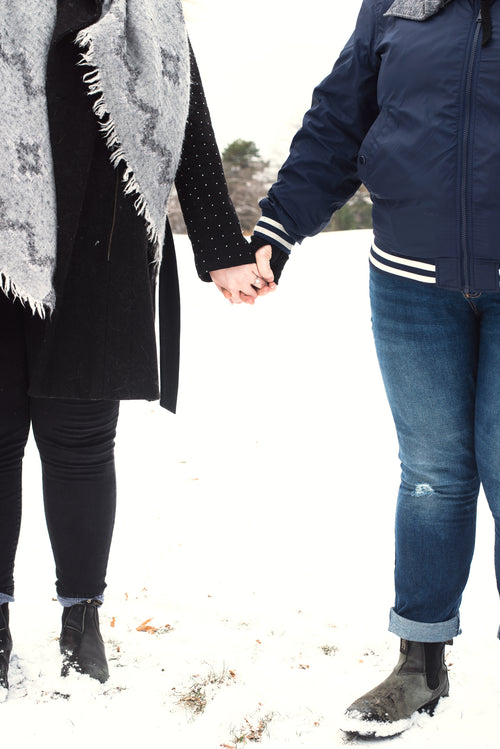 holding hands in the snow