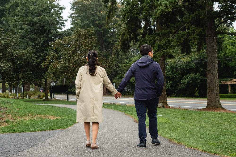 holding hands on a fall walk