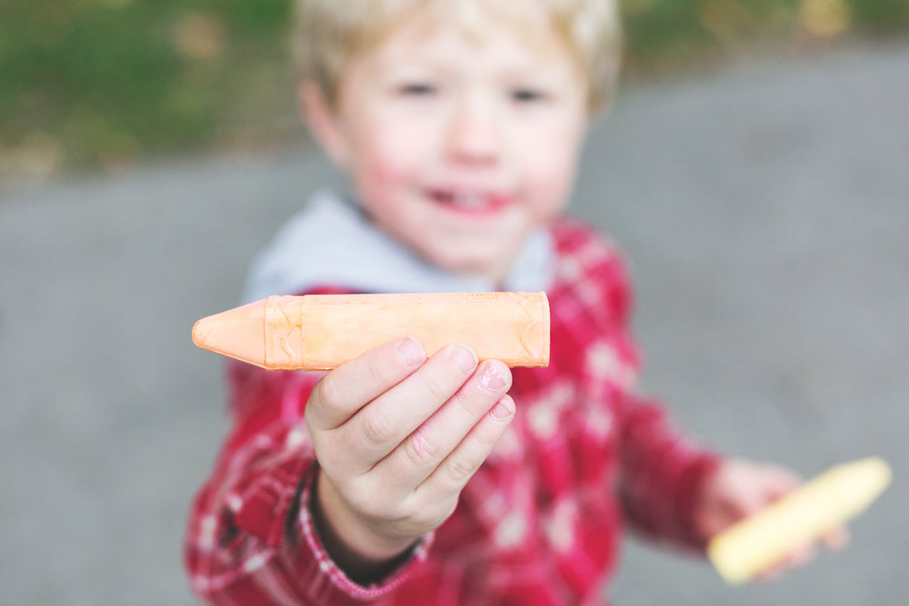 holding sidewalk chalk