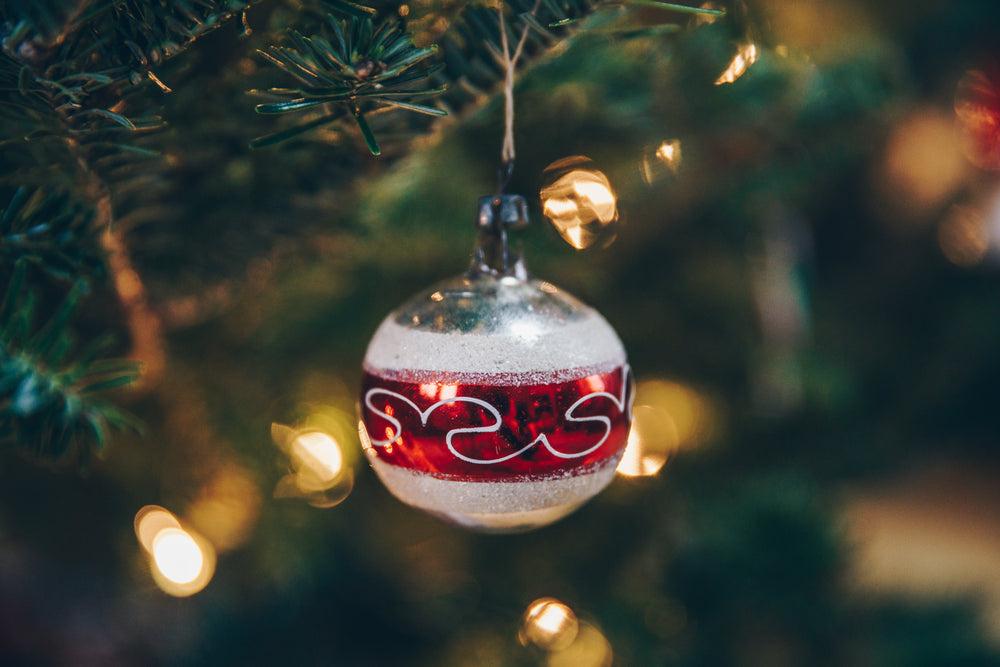 holiday decorated ball ornament on tree