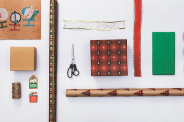 holiday gift wrapping flatlay knolling