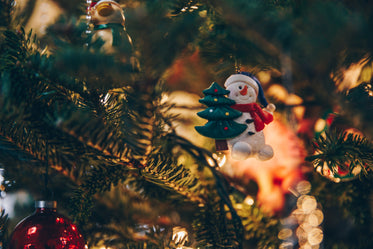 holiday ornaments on lit tree