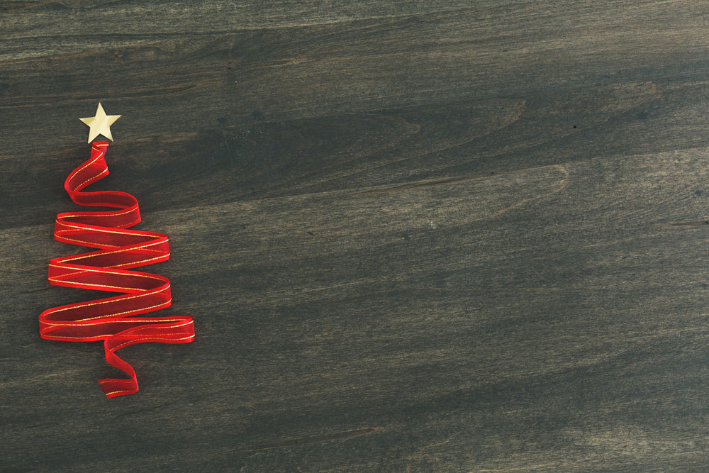 holiday ribbon tree on woodgrain