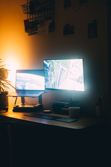 home office lit by computer monitors