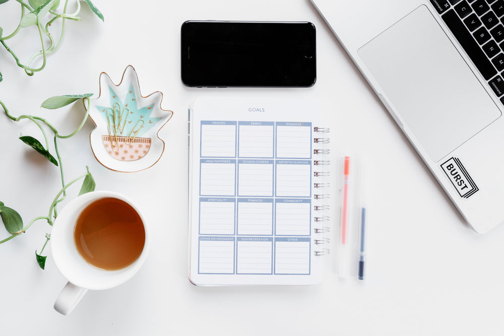 home office supplies set out by computer