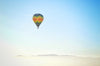 hot air balloon rising into the atmosphere