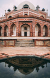 humayun's tomb reflects in a pool