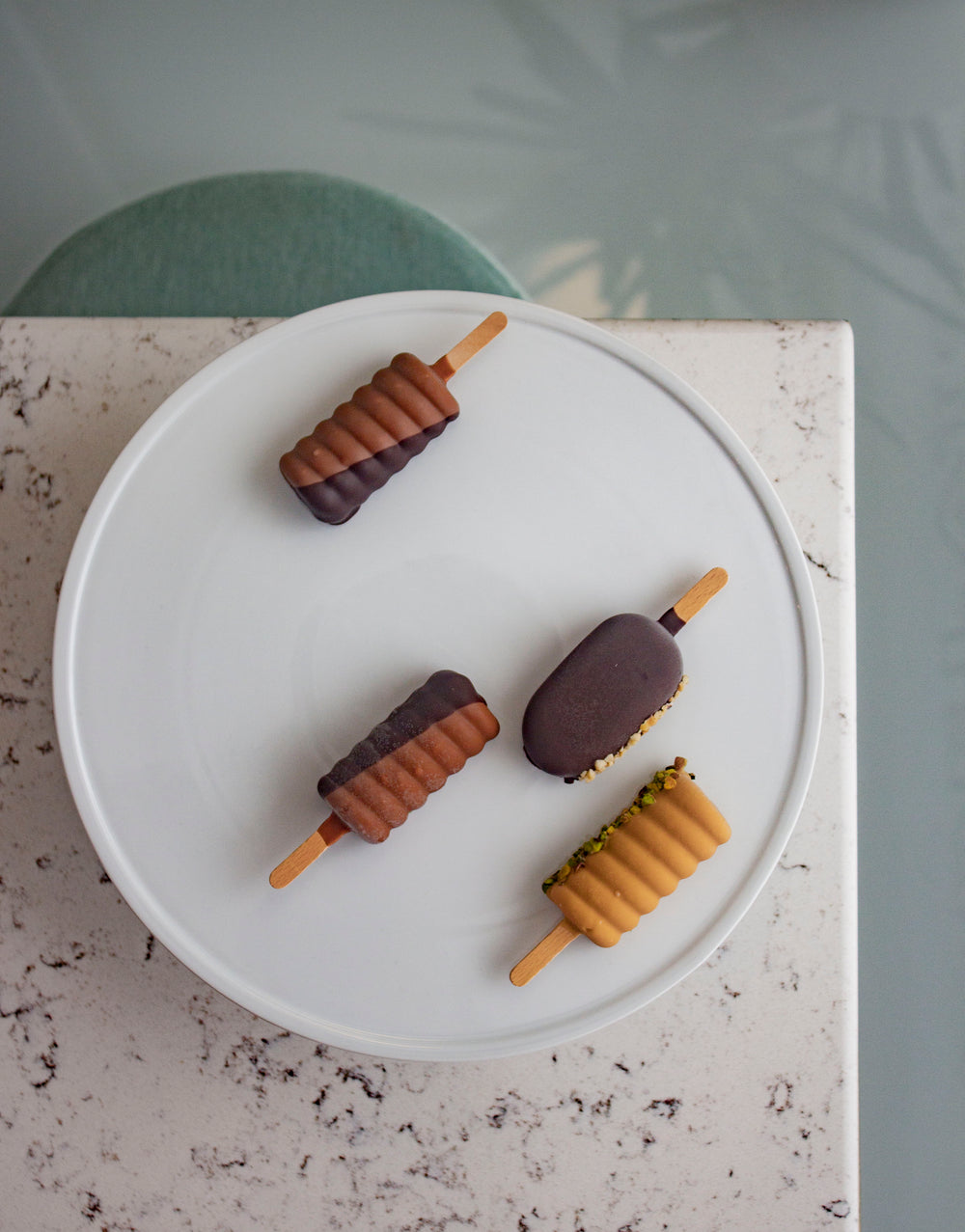 ice-creams covered in chocolate and nuts