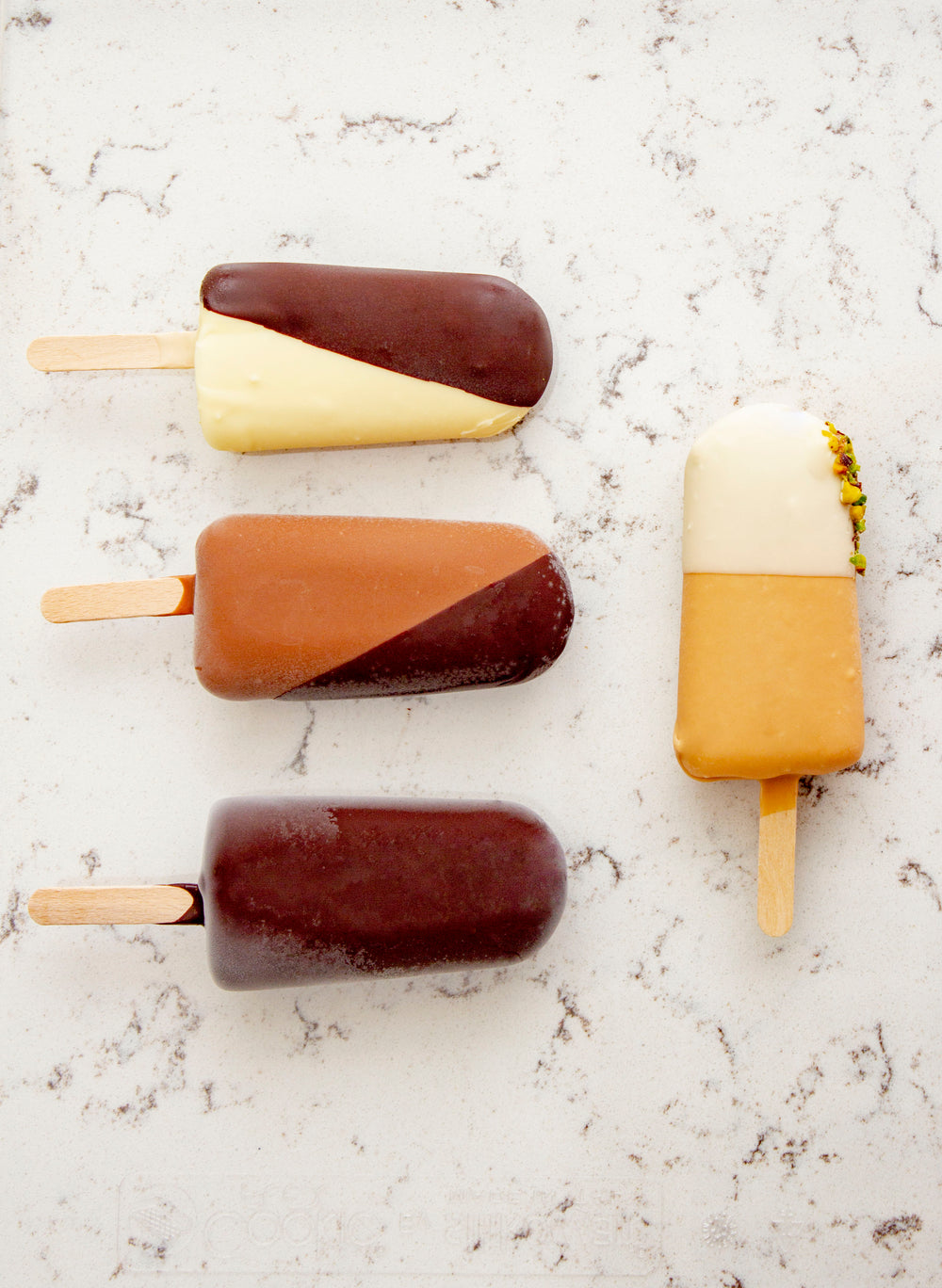 ice-creams of different shades on a marble counter