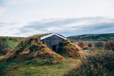 iceland hut in grassy hill