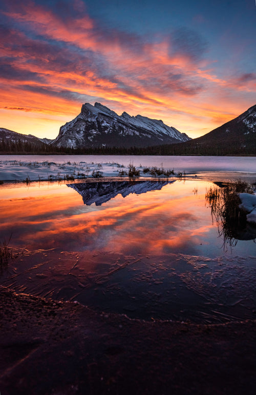 icey mountain reflection at sunset