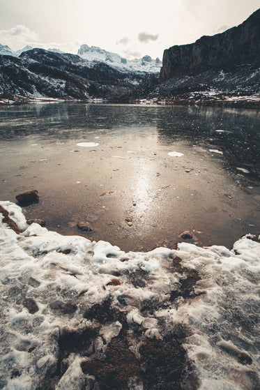 icy lake and snowy mountain tops