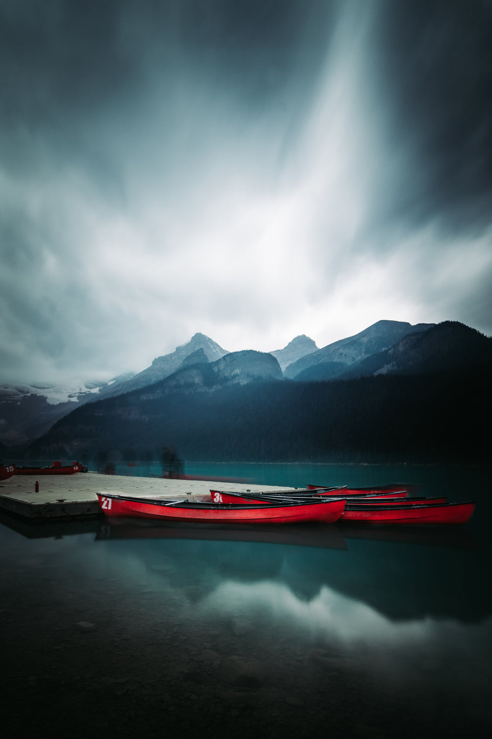 illuminated clouds overlooking a clear lake