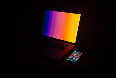 illuminated laptop and mobile phone
