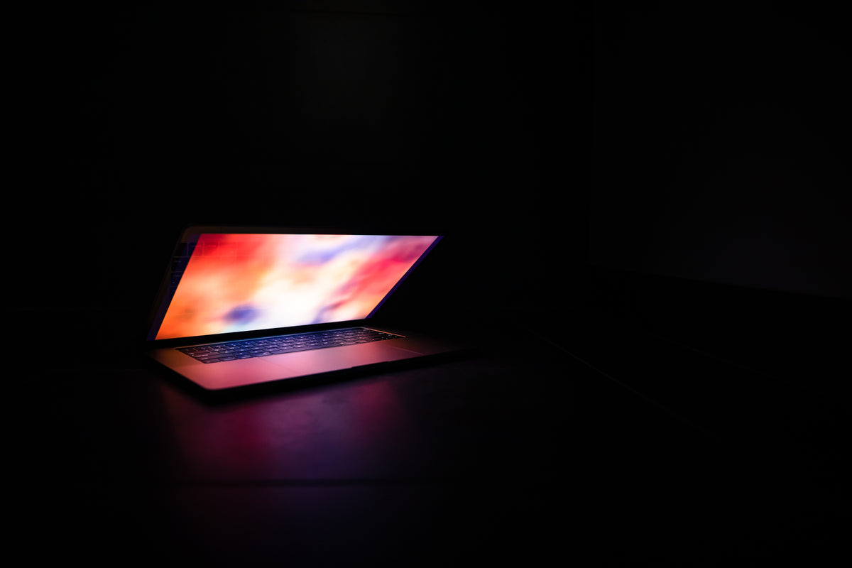 illuminated laptop in the dark