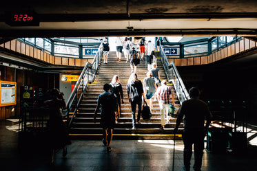 illuminated staircase in a busy station