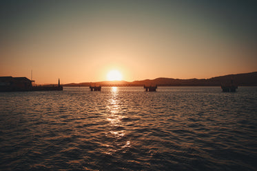 industrial bridge and water at sunset