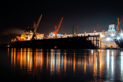 industrial ship dock lit at night