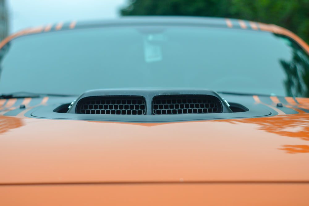 intake on orange sports car