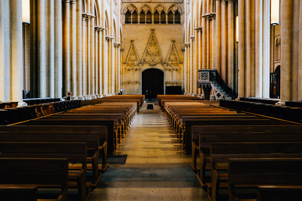 interior of a church with pews lining the aisle