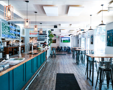 interior of a restaurant with single person at the bar