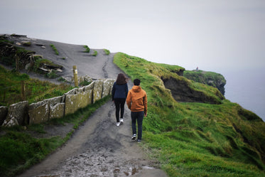 ireland cliffside hikers