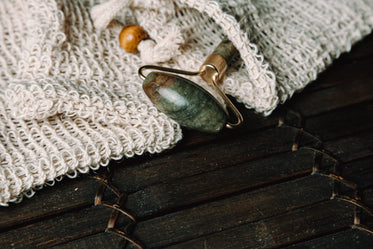 jade face roller on a white cloth