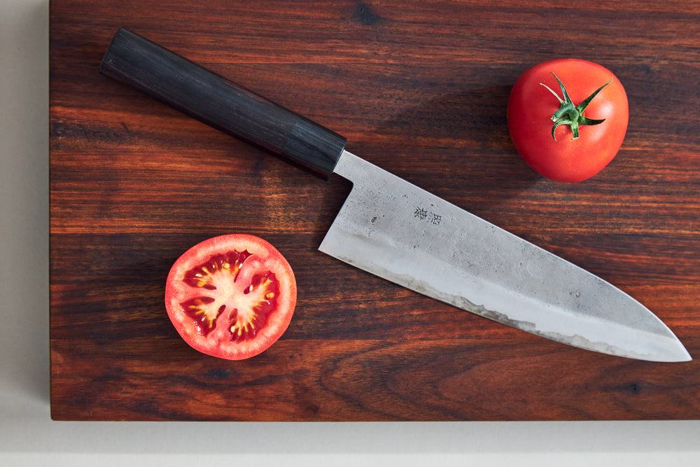 japanese kitchen knife and tomatos