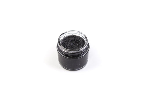 jar of activated charcoal facemask