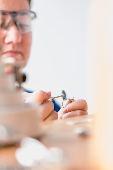 jeweler working on ring