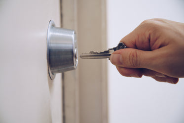 key to padlock in hand