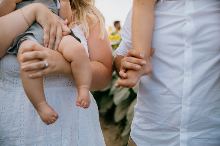 kids-feet-held-by-adults.jpg?width=746&f