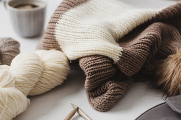 knitwear, yarn, and a mug of coffee