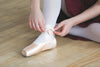 lacing up ballet slippers
