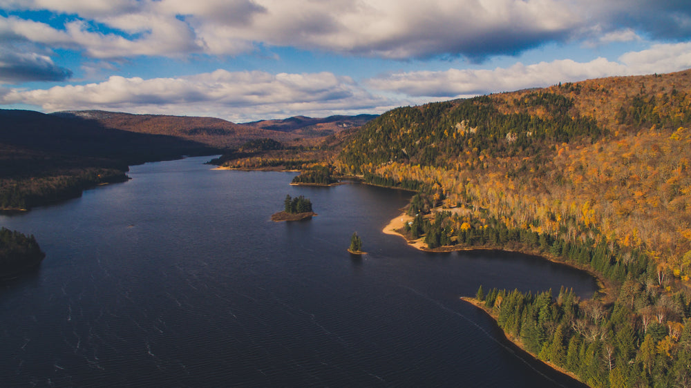 lakes and hills under clouded fall sky